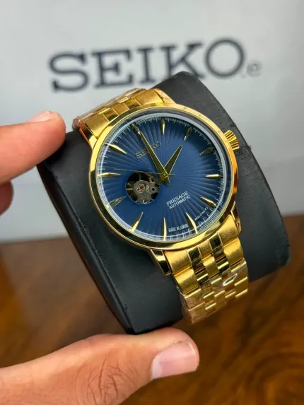 ساعت سیکو اتوماتیک بند طلایی صفحه سرمه ای | Seiko